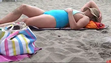 On the beach, stepmother putting on a bikini, showing off and masturbating.