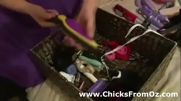 Busty amateur babe shows off her sex toy collection